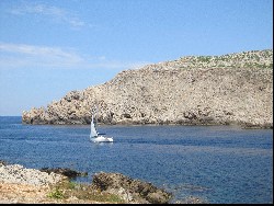 Fornells sailing boat leaving harbour