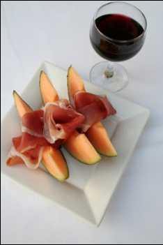 Jamon or Spanish ham with melon at breakfast or as an evening snack