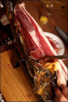 Cutting Spanish ham or Jamon preparation for serving